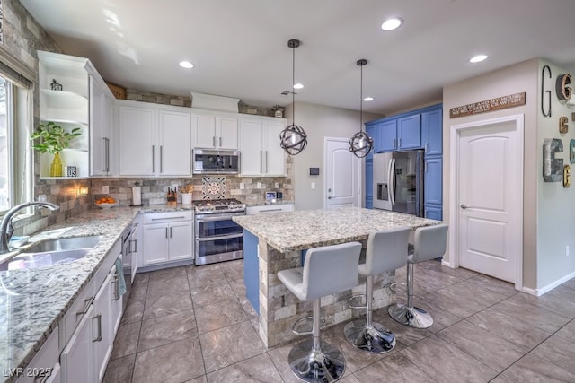 10623 Auburn Springs Ave, Las Vegas, NV 89166 - kitchen featuring appliances with stainless steel finishes, open shelves, a sink, decorative backsplash, and white cabinets