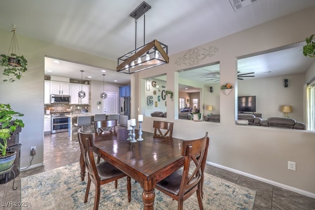 10623 Auburn Springs Ave, Las Vegas, NV 89166 - dining space with tile patterned floors, ceiling fan, and baseboards