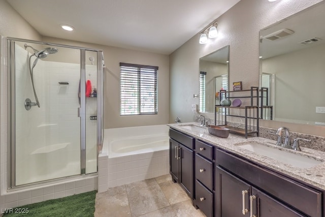 10623 Auburn Springs Ave, Las Vegas, NV 89166 - bathroom with a garden tub, a shower stall, double vanity, and tile patterned flooring