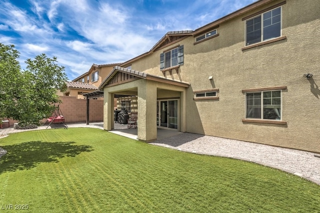 10623 Auburn Springs Ave, Las Vegas, NV 89166 - back of property with stucco siding and a patio area