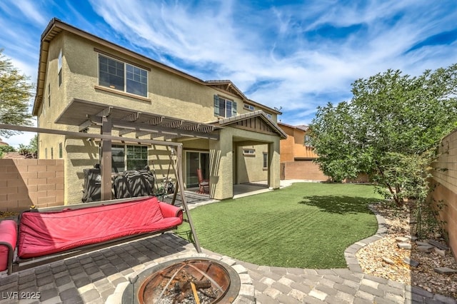 10623 Auburn Springs Ave, Las Vegas, NV 89166 - back of property featuring stucco siding, an outdoor fire pit, a pergola, and a patio