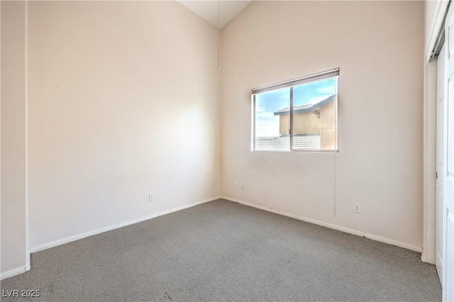 5862 Bluthe Bridge Ave, Las Vegas, NV 89141 - unfurnished room featuring carpet floors, baseboards, and lofted ceiling