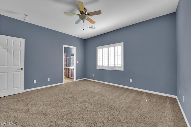 4063 Lower Saxon Ave, North Las Vegas, NV 89085 - unfurnished bedroom featuring carpet flooring, ensuite bathroom, and a ceiling fan