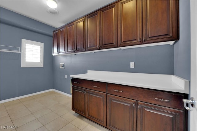 4063 Lower Saxon Ave, North Las Vegas, NV 89085 - laundry room featuring cabinet space, hookup for a washing machine, and light tile patterned floors