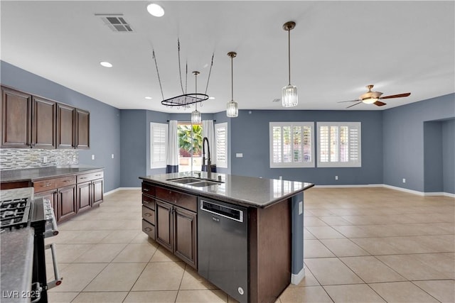 4063 Lower Saxon Ave, North Las Vegas, NV 89085 - kitchen featuring appliances with stainless steel finishes, light tile patterned floors, healthy amount of natural light, and recessed lighting