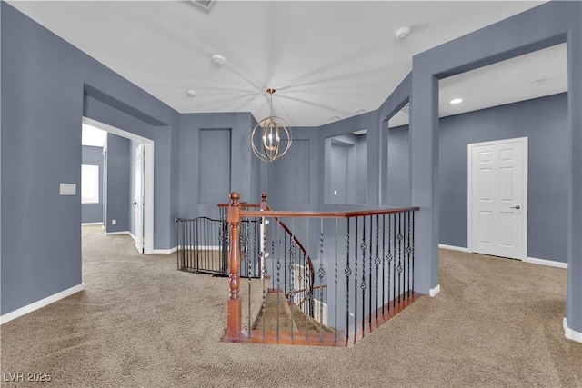 4063 Lower Saxon Ave, North Las Vegas, NV 89085 - hall with an upstairs landing, carpet, and a chandelier