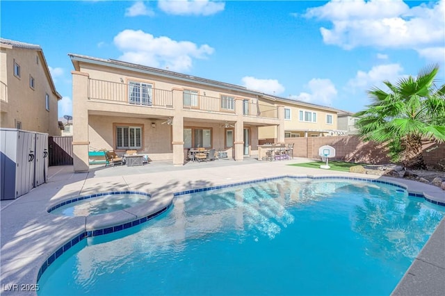 4063 Lower Saxon Ave, North Las Vegas, NV 89085 - view of pool with an in-ground hot tub, a patio area, and a fenced backyard