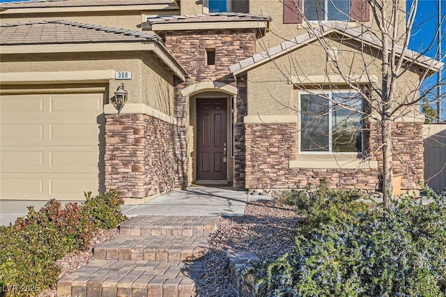 368 Misty Moonlight St, Henderson, NV 89015 - entrance to property with stone siding, a garage, and stucco siding