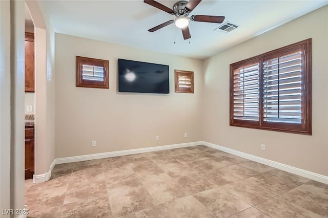 368 Misty Moonlight St, Henderson, NV 89015 - empty room with a ceiling fan, arched walkways, and baseboards