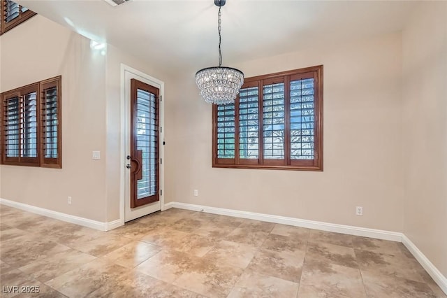 368 Misty Moonlight St, Henderson, NV 89015 - unfurnished dining area featuring a chandelier and baseboards