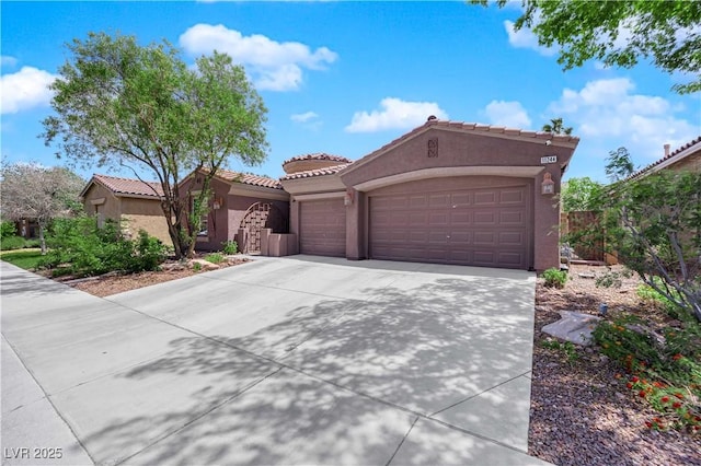 11244 Gammila Dr, Las Vegas, NV 89141 - view of front of house with stucco siding, an attached garage, concrete driveway, a tiled roof, and fence