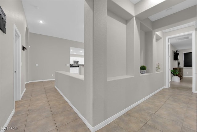 11244 Gammila Dr, Las Vegas, NV 89141 - hallway featuring light tile patterned floors, recessed lighting, and baseboards