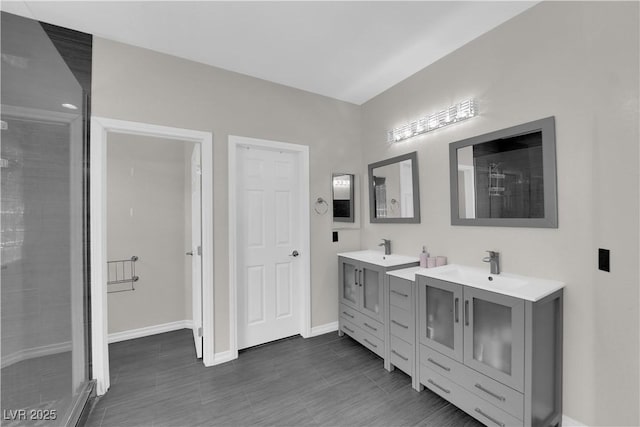 11244 Gammila Dr, Las Vegas, NV 89141 - full bath featuring tiled shower, baseboards, and vanity