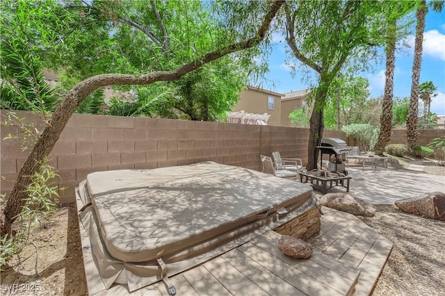 11244 Gammila Dr, Las Vegas, NV 89141 - view of patio featuring fence, a fire pit, a wooden deck, and grilling area