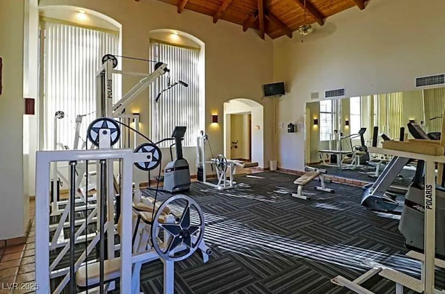 8455 W Sahara Ave Unit 213, Las Vegas, NV 89117 - gym featuring high vaulted ceiling, arched walkways, wooden ceiling with exposed beams, and carpet floors