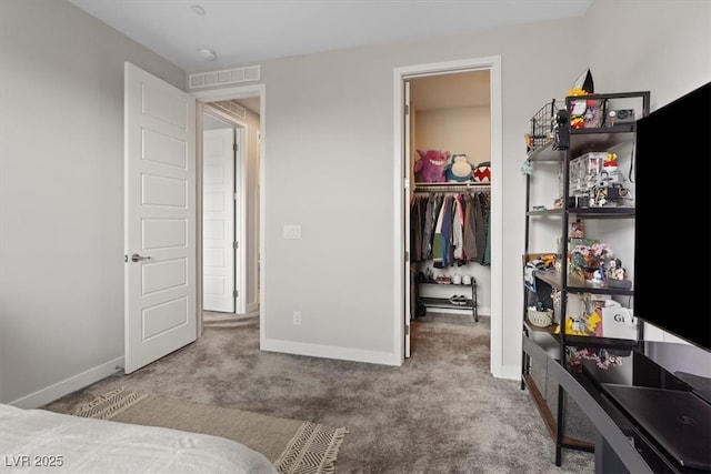10324 Stroma Ave, Las Vegas, NV 89166 - bedroom with carpet floors, a walk in closet, a closet, and baseboards