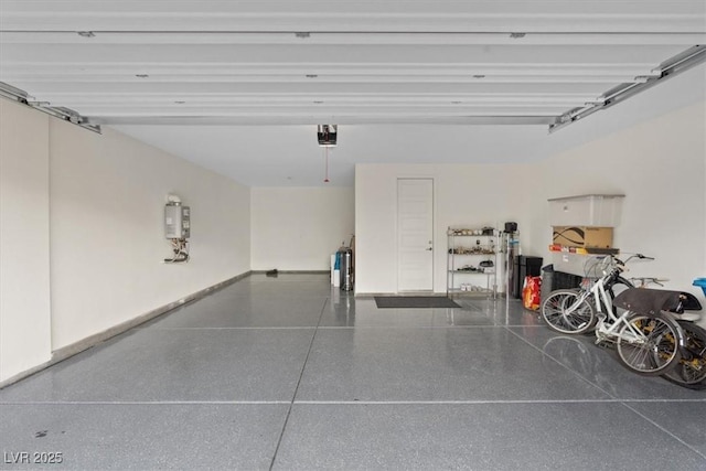 10324 Stroma Ave, Las Vegas, NV 89166 - garage featuring water heater and a garage door opener