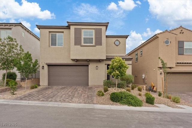 10324 Stroma Ave, Las Vegas, NV 89166 - traditional home with stucco siding, an attached garage, and decorative driveway
