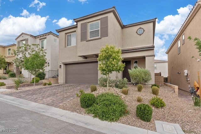 10324 Stroma Ave, Las Vegas, NV 89166 - view of front of home featuring a garage, stucco siding, and driveway