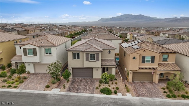 10324 Stroma Ave, Las Vegas, NV 89166 - mediterranean / spanish-style home with a residential view, stucco siding, and an attached garage