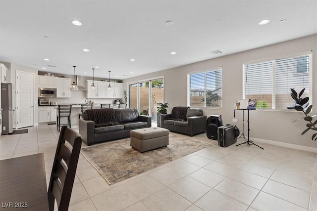 10324 Stroma Ave, Las Vegas, NV 89166 - living area featuring recessed lighting, light tile patterned flooring, and baseboards