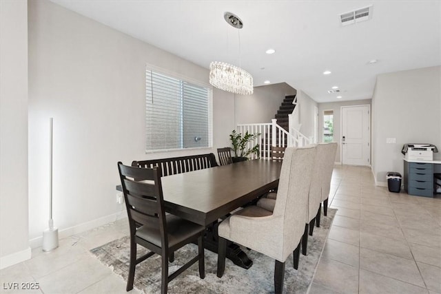 10324 Stroma Ave, Las Vegas, NV 89166 - dining space with stairway, light tile patterned flooring, recessed lighting, baseboards, and a chandelier