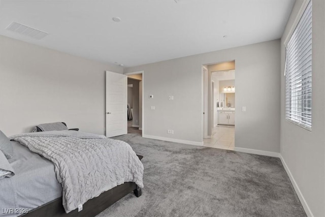 10324 Stroma Ave, Las Vegas, NV 89166 - carpeted bedroom featuring baseboards and ensuite bathroom