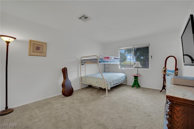 carpeted bedroom with baseboards