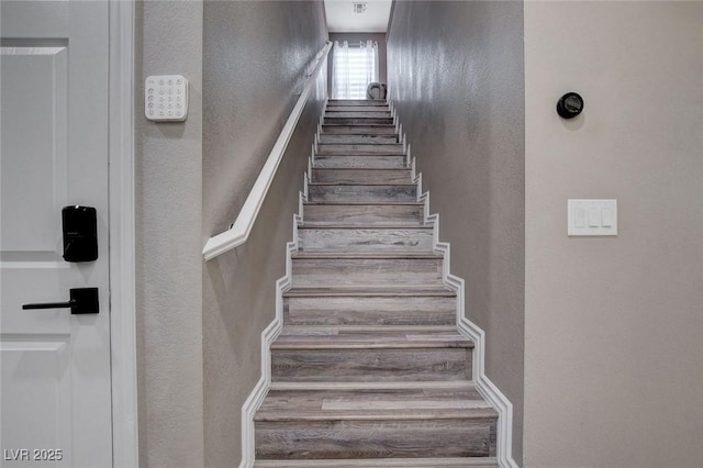 1637 Harvest Pecan Ct, Las Vegas, NV 89108 - stairs featuring wood finished floors and a textured wall