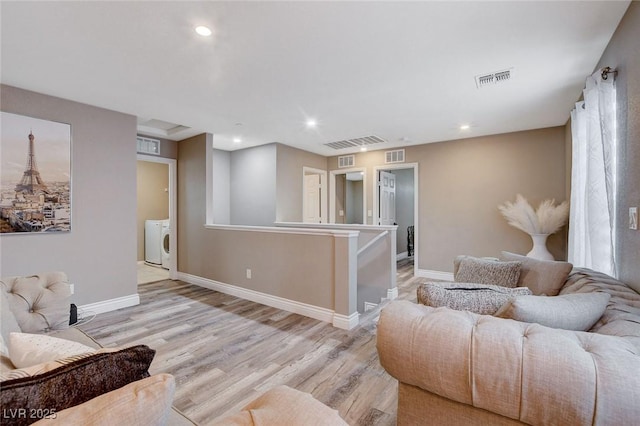1637 Harvest Pecan Ct, Las Vegas, NV 89108 - living area featuring wood finished floors, recessed lighting, baseboards, and washing machine and dryer