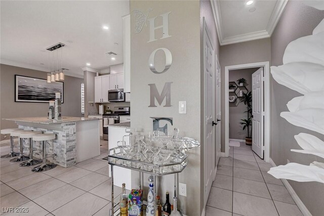 1637 Harvest Pecan Ct, Las Vegas, NV 89108 - hall with crown molding, light tile patterned flooring, baseboards, a sink, and recessed lighting