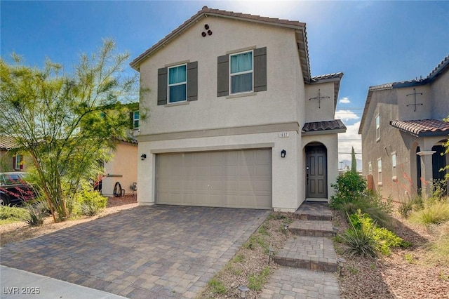 1637 Harvest Pecan Ct, Las Vegas, NV 89108 - view of front of home with stucco siding, an attached garage, a tile roof, and decorative driveway