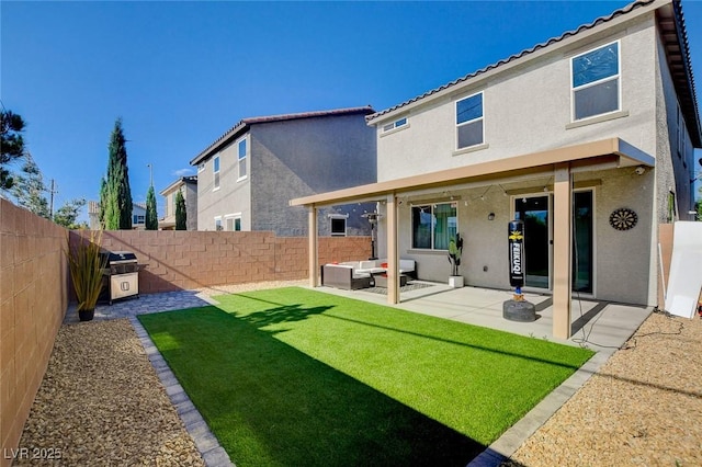 1637 Harvest Pecan Ct, Las Vegas, NV 89108 - rear view of house featuring stucco siding, an outdoor hangout area, a patio area, and a tiled roof