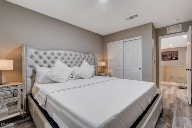 1637 Harvest Pecan Ct, Las Vegas, NV 89108 - bedroom featuring wood finished floors, a closet, and baseboards