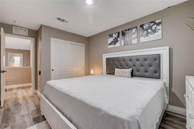 1637 Harvest Pecan Ct, Las Vegas, NV 89108 - bedroom with wood finished floors, baseboards, and a closet
