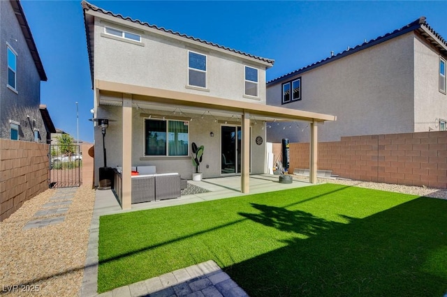 1637 Harvest Pecan Ct, Las Vegas, NV 89108 - rear view of property featuring stucco siding, a patio, a gate, a tiled roof, and an outdoor hangout area