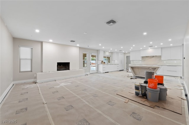 3075 Santa Margarita St, Las Vegas, NV 89146 - living area featuring recessed lighting, a fireplace with raised hearth, and baseboards