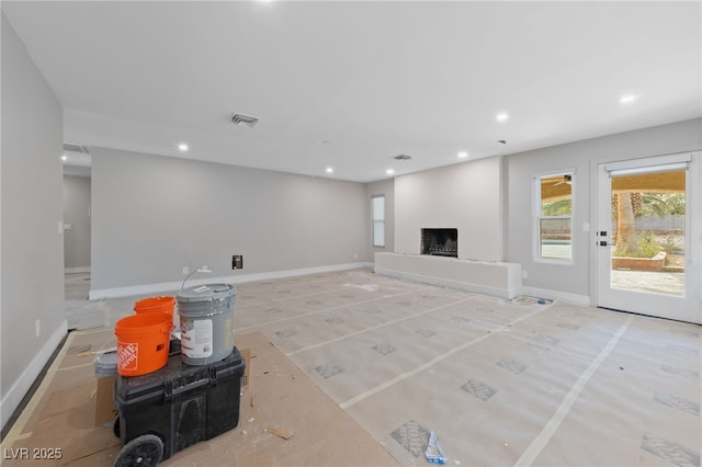 3075 Santa Margarita St, Las Vegas, NV 89146 - unfurnished living room featuring a fireplace with raised hearth, recessed lighting, and baseboards