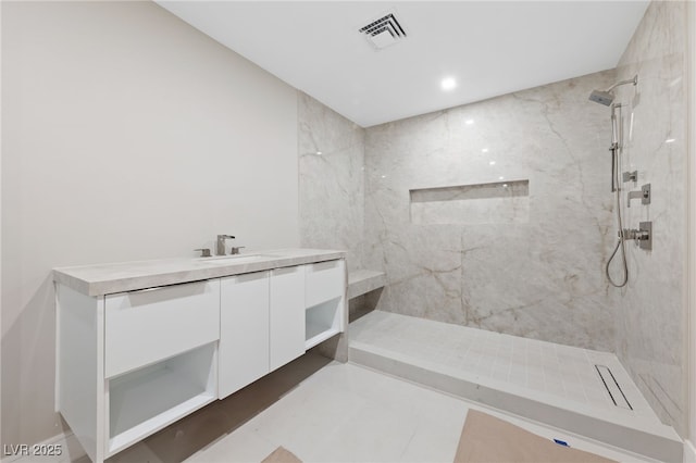 3075 Santa Margarita St, Las Vegas, NV 89146 - bathroom featuring a marble finish shower, vanity, and recessed lighting