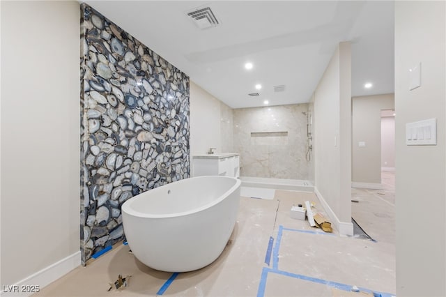 3075 Santa Margarita St, Las Vegas, NV 89146 - bathroom featuring a walk in shower, a freestanding bath, a sink, and recessed lighting