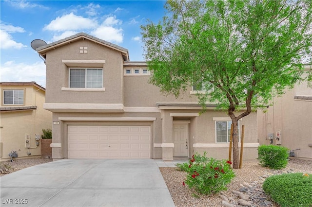 125 Sharp Edge Ave, North Las Vegas, NV 89031 - view of front facade featuring stucco siding, driveway, and a garage