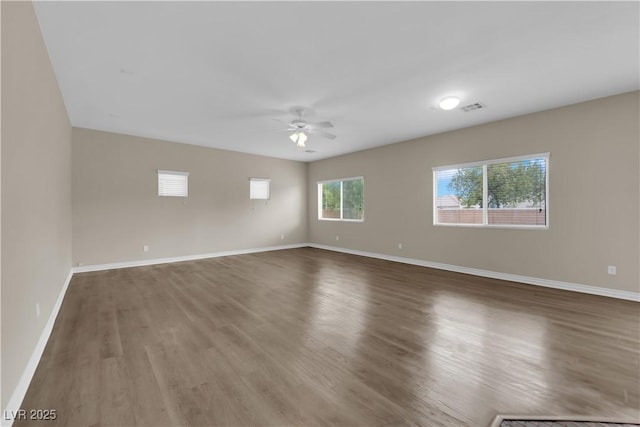 125 Sharp Edge Ave, North Las Vegas, NV 89031 - empty room with a ceiling fan, wood finished floors, and baseboards