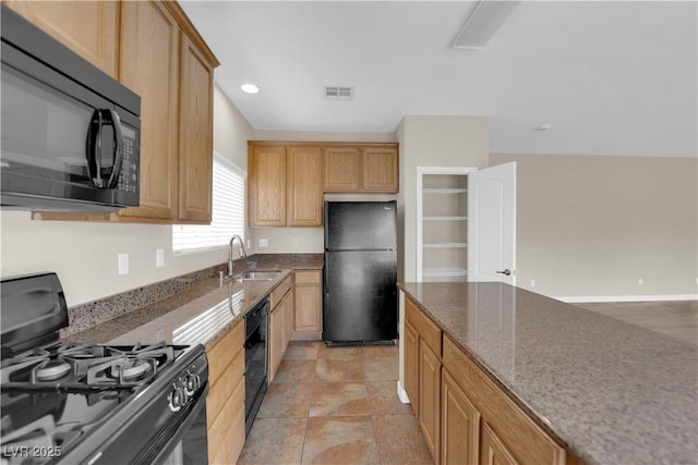 125 Sharp Edge Ave, North Las Vegas, NV 89031 - kitchen featuring black appliances, a sink, stone countertops, light brown cabinets, and recessed lighting