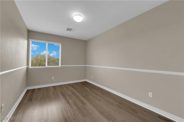 125 Sharp Edge Ave, North Las Vegas, NV 89031 - unfurnished room featuring dark wood-style flooring and baseboards