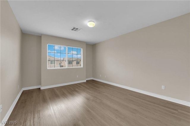 125 Sharp Edge Ave, North Las Vegas, NV 89031 - empty room featuring wood finished floors and baseboards