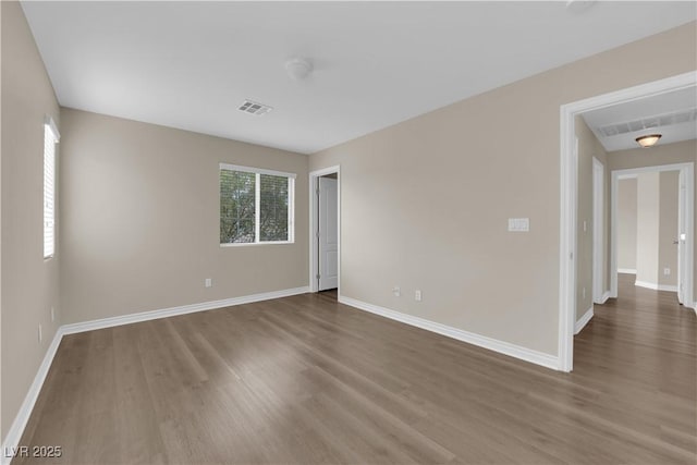 125 Sharp Edge Ave, North Las Vegas, NV 89031 - unfurnished room featuring wood finished floors and baseboards