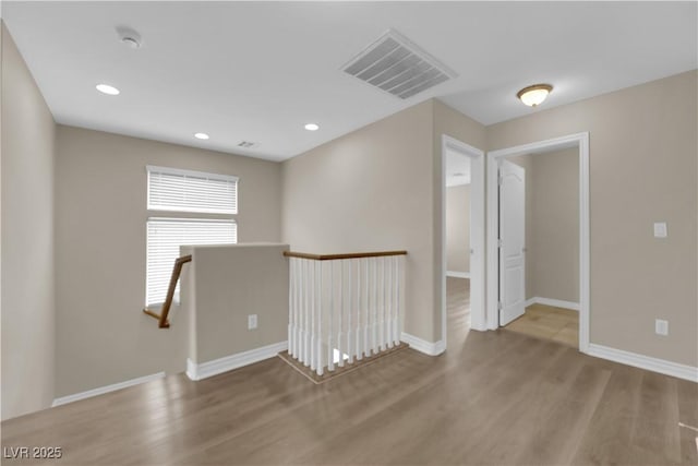 125 Sharp Edge Ave, North Las Vegas, NV 89031 - empty room featuring wood finished floors, baseboards, and recessed lighting