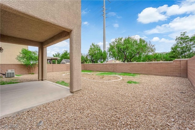 125 Sharp Edge Ave, North Las Vegas, NV 89031 - fenced backyard featuring a patio and cooling unit