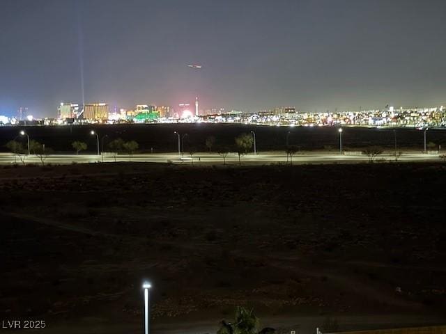 8255 Las Vegas Blvd Unit 611, Las Vegas, NV 89123 - yard at night featuring a view of city lights