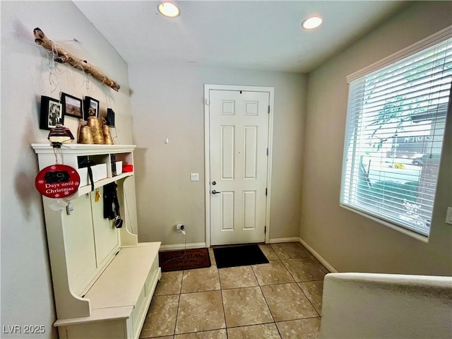 mudroom featuring light tile patterned floors, baseboards, and recessed lighting